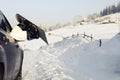 Women,s legs in snowboard from the car near beauty view of mountains and christmas trees in winter Royalty Free Stock Photo