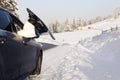 Women,s legs in snowboard from the car near beauty view of mountains and christmas trees in winter Royalty Free Stock Photo