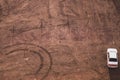 Car stands on the sand. aerial view. ground with tracks and footprints. conceptual background with copy space Royalty Free Stock Photo