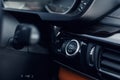 Car Start-Stop Engine Button of a modern car in the interior of the expensive car. Black and brown leather car interior Royalty Free Stock Photo