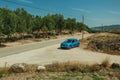 Car stop on a countryside dirt road in rocky landscape