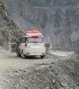 A car stopping on dangerous mountain road