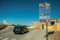 Car in street with signpost indicating public services and city attractions at Elvas Royalty Free Stock Photo