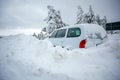 Car stuck in deep snow on mountain road - winter traffic problem Royalty Free Stock Photo