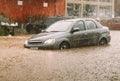 Car stuck in flash flood disaster