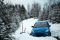 Car Stuck in the Snow on a Forest Road. Royalty Free Stock Photo