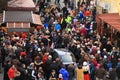 Car stucked in crowd of people on carnival