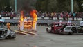 Car with stuntman on hood crashes into fire wall, sequence