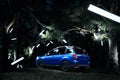 Car Subaru Forester stand in forest, concept lights at night