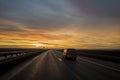 Car on the sunset road. Royalty Free Stock Photo