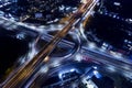 Car, taxi, and bus traffic on road intersection at night, traffic transportation, Asia city life, public transportation, financial