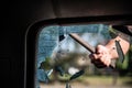 Car thief breaks the car window Royalty Free Stock Photo