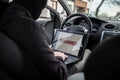 Car thief disarming car protections with laptop computer