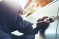 Car thief a man in a hooded top black clothes Royalty Free Stock Photo