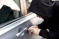 Car thief steal car breaking door criminal job burglar Hijacks Auto thief in black wear Royalty Free Stock Photo