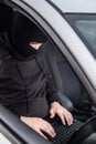 Car Thief tries to disarm car security systems Royalty Free Stock Photo