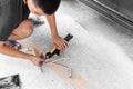 Car tire changed for maintenance in garage using hydraulic jack - car maintenance concept