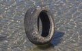Car tire in the clear waters in the river Drina.
