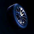 Car tire with depth of field blur on black background
