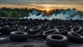 Car tire dump, tire storage yard fire, black smoke rising from the dump Royalty Free Stock Photo