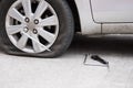 Car tire leak because of nail pounding. flat tyre on road. Flatt Royalty Free Stock Photo