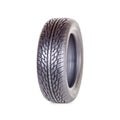 Car tire, new tyre Surpasa Maxxis on white background isolated close up