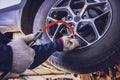 Car Tire Pressure Check in the Auto Service Garage