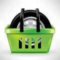 Car tire in shopping cart/basket Royalty Free Stock Photo