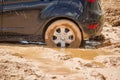 Car tire stuck in the mud background Royalty Free Stock Photo