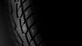 Car tire with studs macro, fragment, blurred background Royalty Free Stock Photo