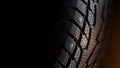 Car tire with studs macro, fragment, blurred background Royalty Free Stock Photo