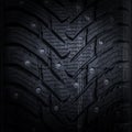 Car tire with studs macro, fragment, blurred backgroundd Royalty Free Stock Photo