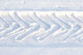 Car tire track on the snow close-up Royalty Free Stock Photo