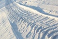 Car tire track on the snow close-up Royalty Free Stock Photo