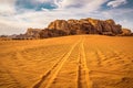 Car tire tracks on sand desert. Wadi Rum, Arabian, Kalahari or Sahara Royalty Free Stock Photo