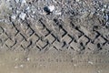 Car tire tracks on wet muddy trail royalty, road, abstract background, texture material. Tyre track on dirt sand or mud, retro Royalty Free Stock Photo