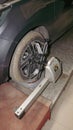 a car tire under maintenance and correction of steering angles