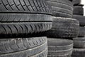 Car tires pneus stacked in rows