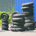 Car tires, rims and tubes next to the tire shop Royalty Free Stock Photo