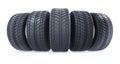 Car tires in row on white background. New black wheel tyres for