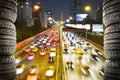 Car tires standing on traffic road city lights Royalty Free Stock Photo