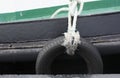 Car tires used as a fender for a ship Royalty Free Stock Photo