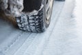 Car tires on winter road