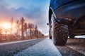 Car tires on winter road covered with snow Royalty Free Stock Photo