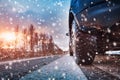 Car tires on winter road covered with snow Royalty Free Stock Photo