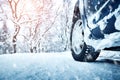 Car tires on winter road Royalty Free Stock Photo