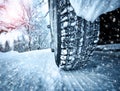 Car tires on winter road Royalty Free Stock Photo