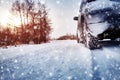 Car tires on winter road covered with snow Royalty Free Stock Photo