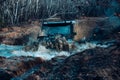 A car during a tough off-road competition diving in a muddy pool. Extreme weekends. Royalty Free Stock Photo