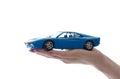 Car toy on palm Royalty Free Stock Photo